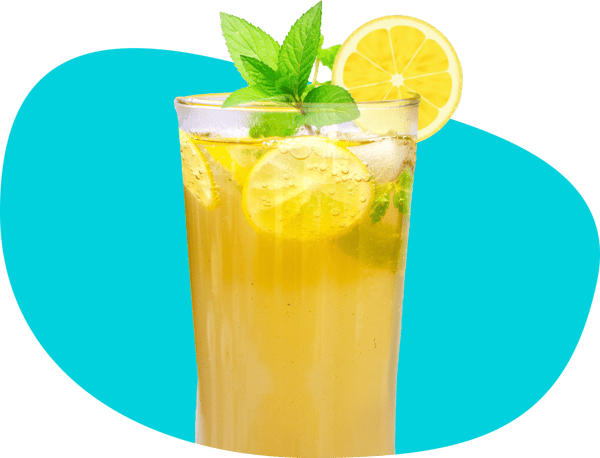 Glass of iced basil lemonade, complete with lemon round garnish