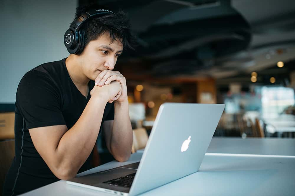 Student looking at their laptop