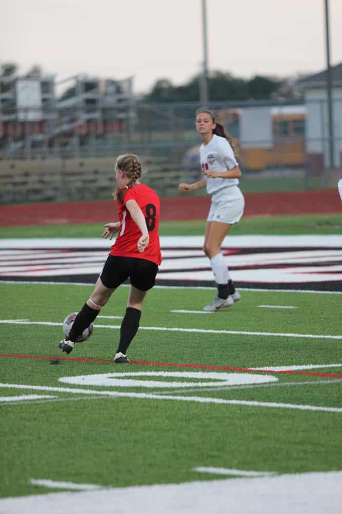 Students playing soccer